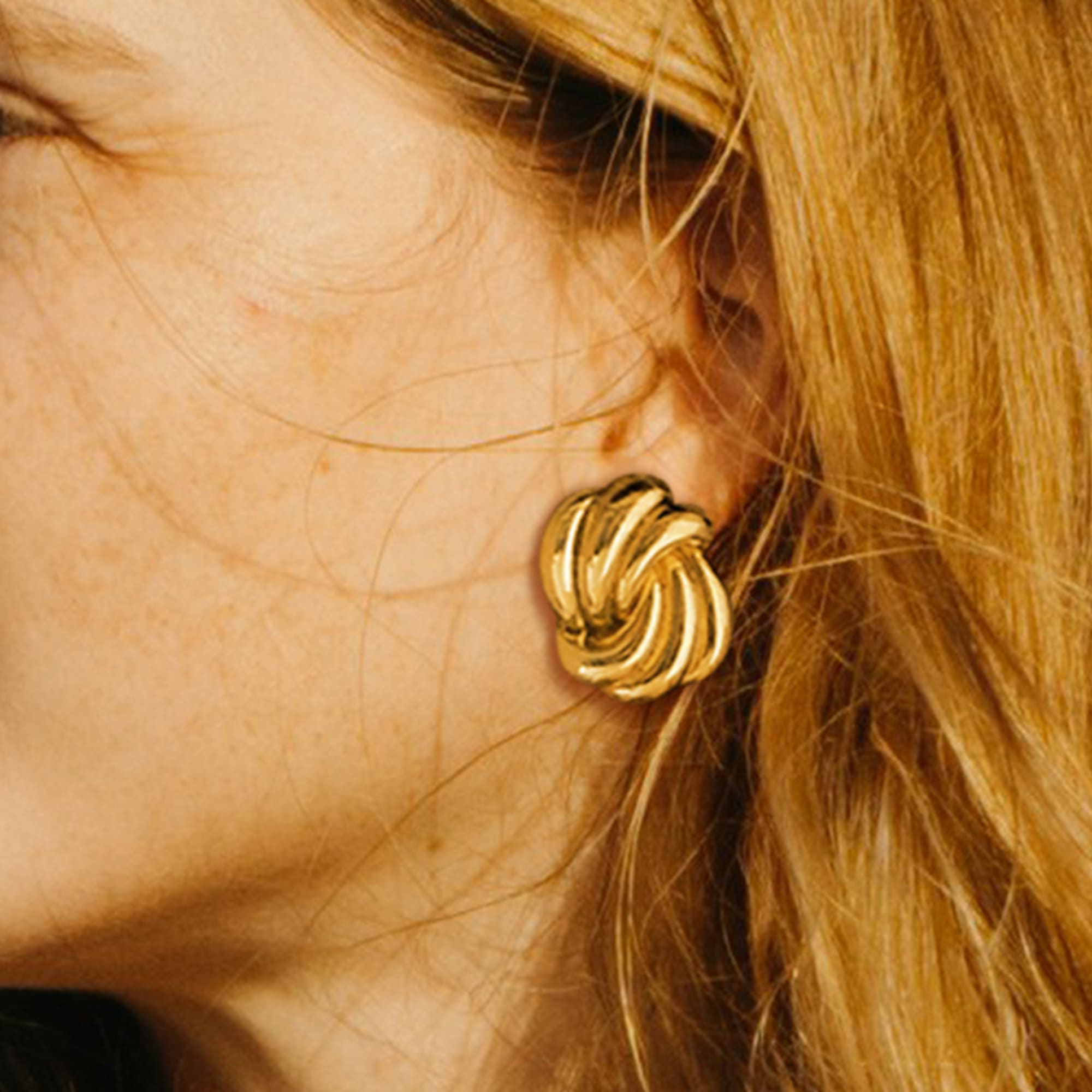 Intertwined Gold layered Stud Earrings - Image 2
