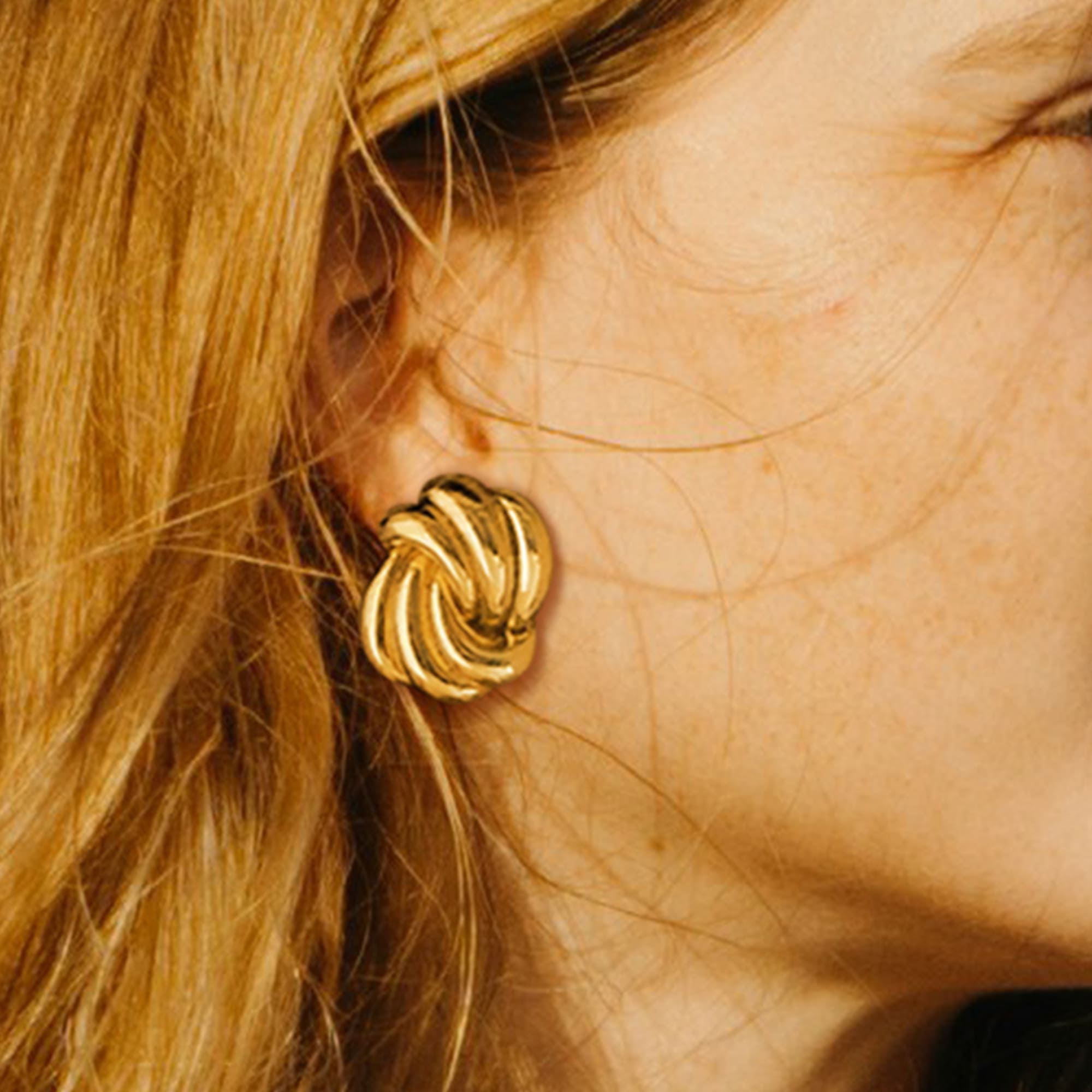 Intertwined Gold layered Stud Earrings - Image 2